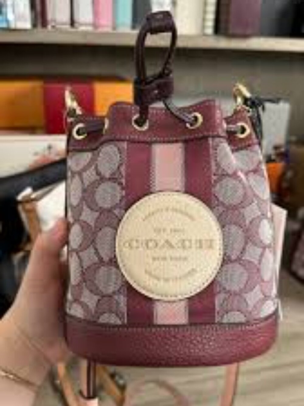 COACH MINI DEMPSEY BUCKET BAG IN SIGNATURE JACQUARD WITH STRIPE & COACH PATCH